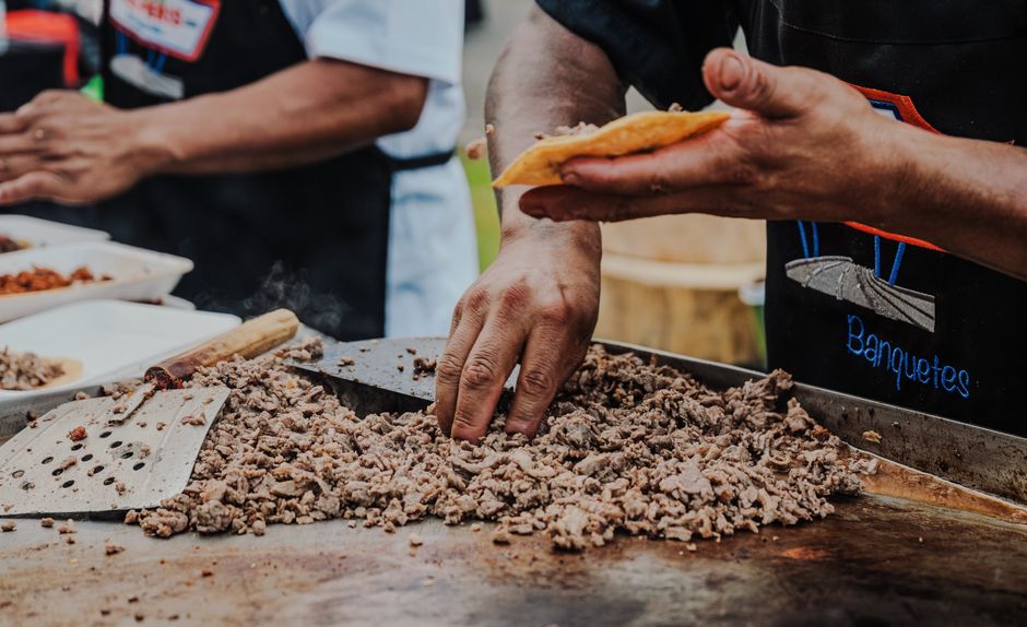 Street tacos cooking on the griddle